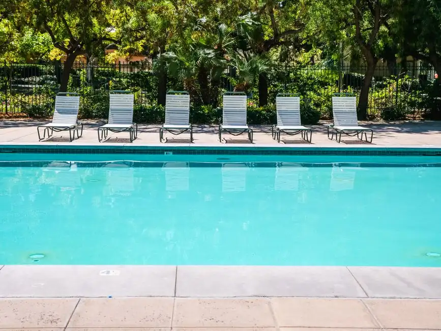 Residential swimming pool with lounge chairs